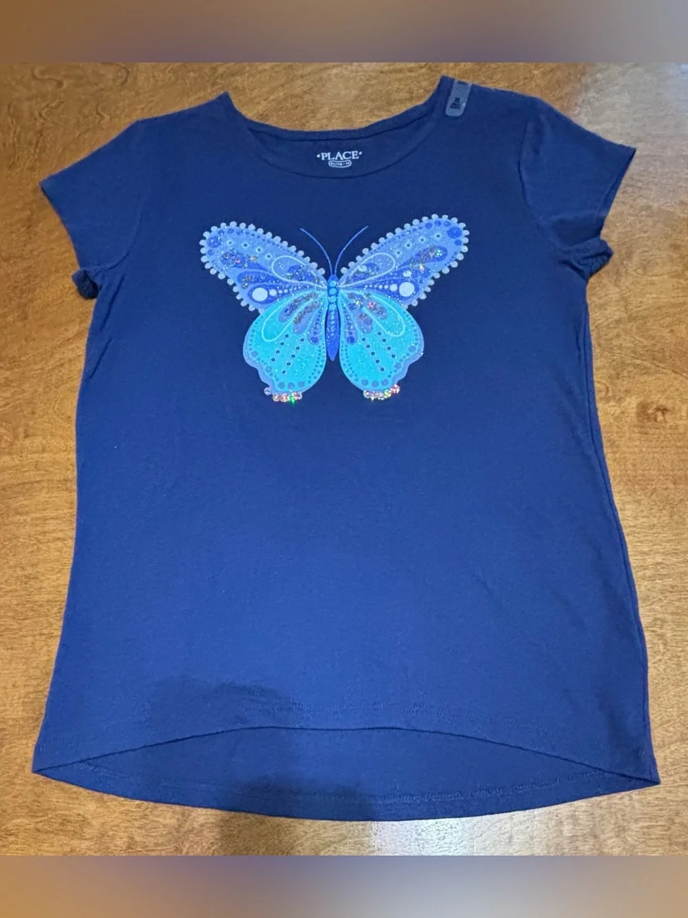 Girl’s-Kids navy blue s/s high-low style Tee with sparkle butterfly